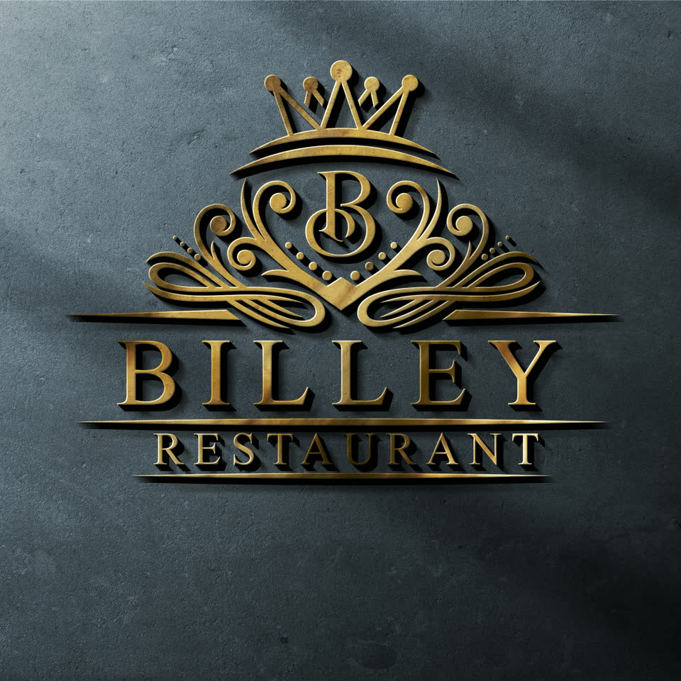 Maquette du logotype Billey Restaurant en finition dorée sur un mur minéral sombre.